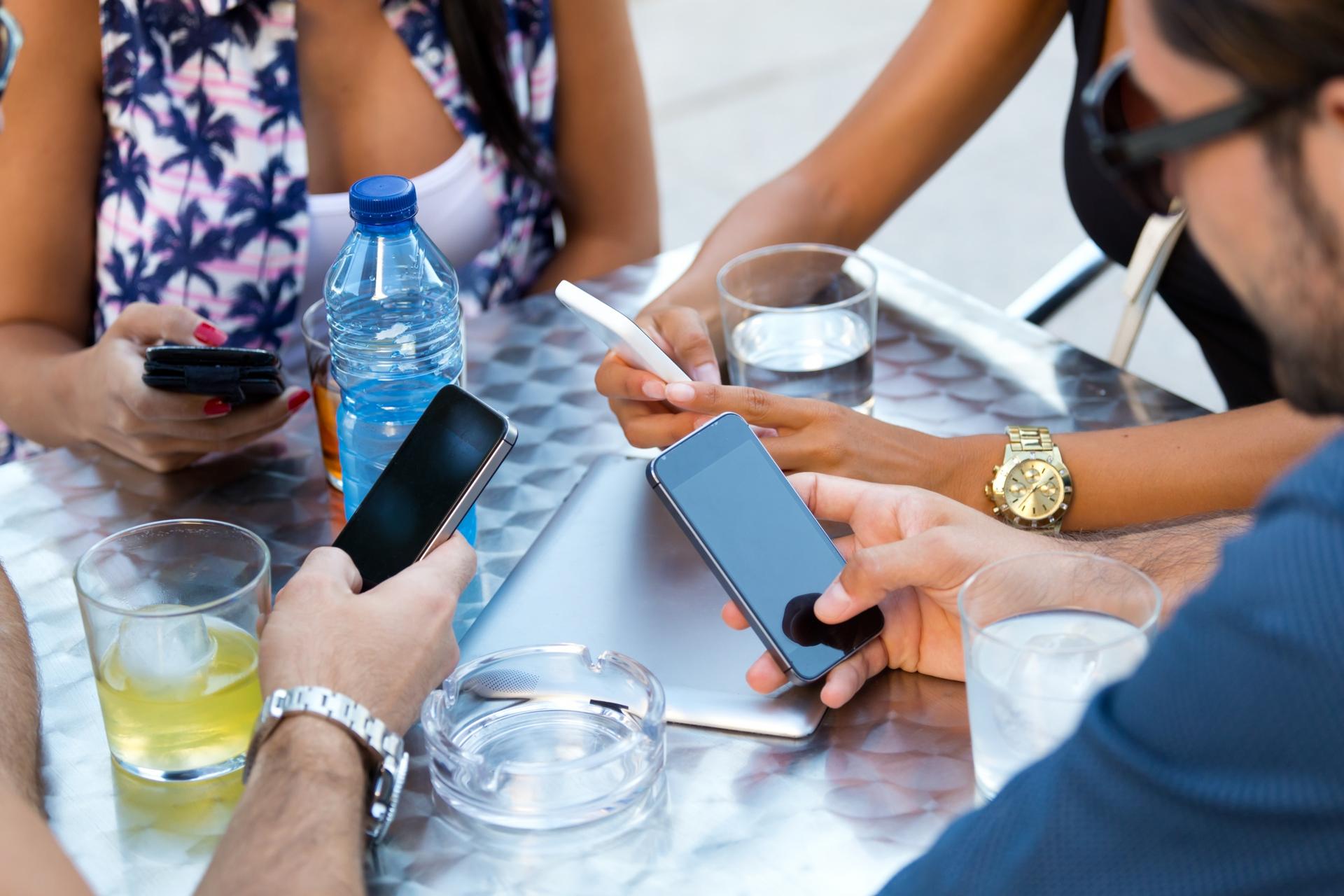 Smartphone, laptop and tablet connected via eSIM while traveling