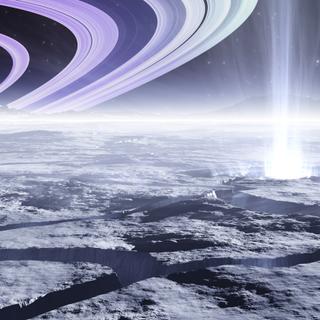 Une vue d'artiste de la surface d'Encelade avec ses geysers et Saturne en arrière plan. © Peter Jurik, Adobe Stock
