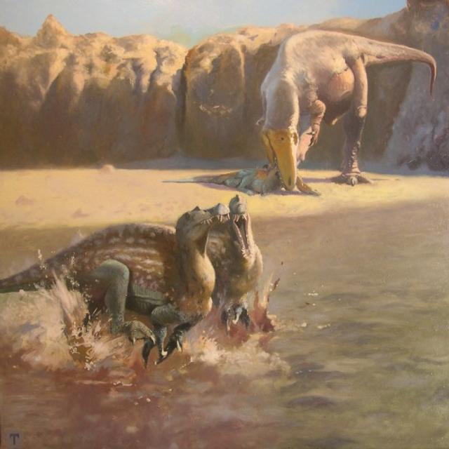 Emiliano Troco a imaginé le Sauroniops pachytholus en se basant sur la description faite par Andrea Cau. Il nous livre sa vision du dinosaure, ici en arrière-plan. Il mange&amp;nbsp;un Spinosaurus juvénile. © Andrea Cau