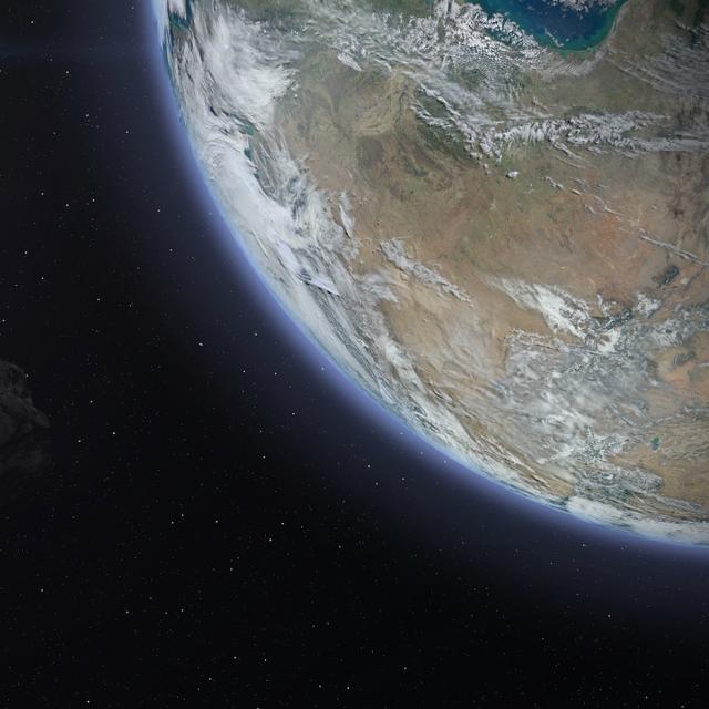 Illustration d&#39;un astéroïde survolant la Terre.&amp;nbsp;© revers_jr, Adobe Stock