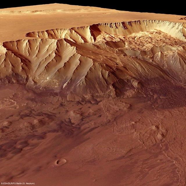 À 9 km sous le niveau moyen de la surface de Mars, Melas Chasma est sans doute le canyon le plus profond de la planète. C&#39;est aussi un des sites d&#39;atterrissage envisagés pour une mission humaine car il présente plusieurs intérêts. © Esa/DLR/FU Berlin/G. Neukum